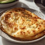 freshly baked cottage cheese and egg flatbread served on a marble surface