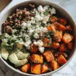 Top down view of Cottage Cheese Sweet Potato Beef Bowl with ground beef and avocado